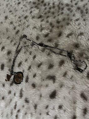 Louis Vuitton Silver-Tone Coin Pendant Necklace with Gold LV Charm